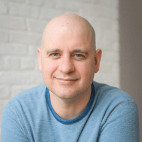 A headshot of Brandt Passalacqua, the Lead Teacher for Breathing Deeply's yoga therapy training for nurses and professionals from all fields