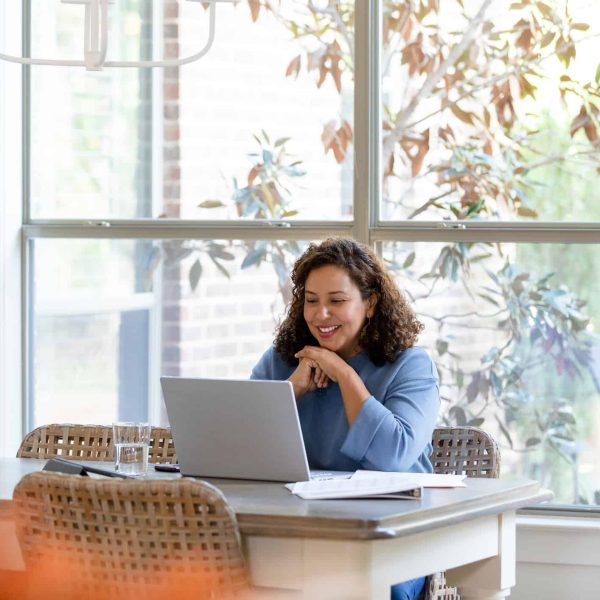 A student joins a class from her laptop.
